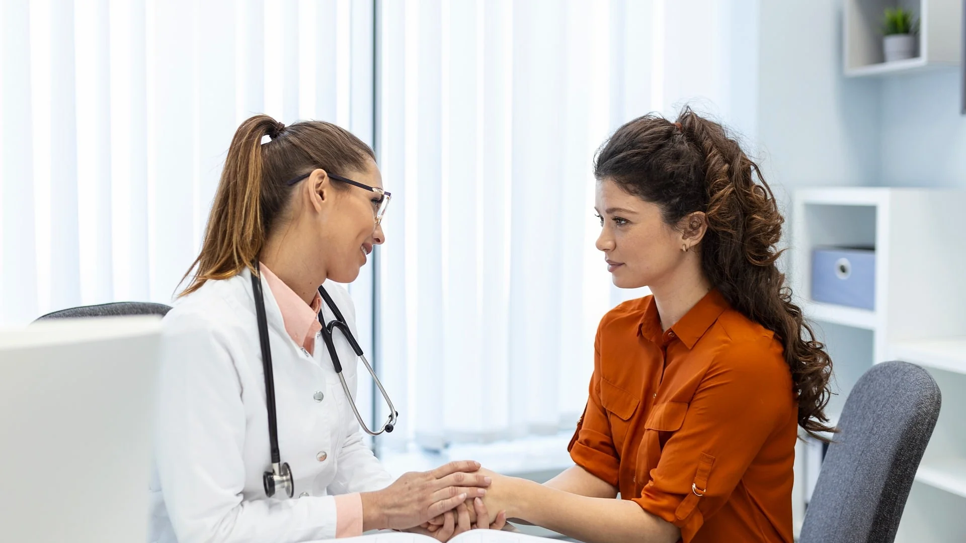 Woman speaking with fertility nurse about IVF financing options